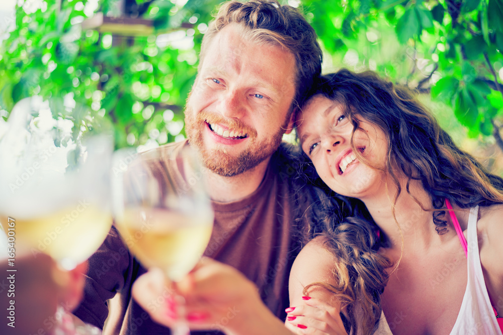 Young Caucasian couple drinking wine at the bar Young Caucasian couple drinking wine at the bar