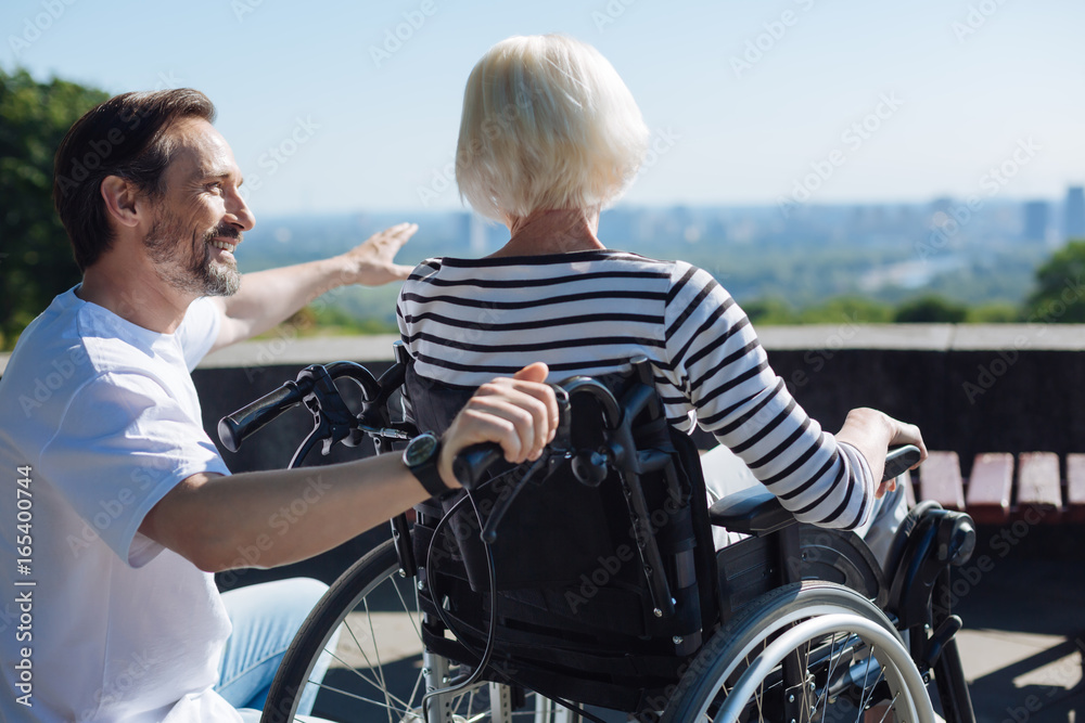 Sincere clever man pointing at something on horizon Sincere clever man pointing at something on horizon