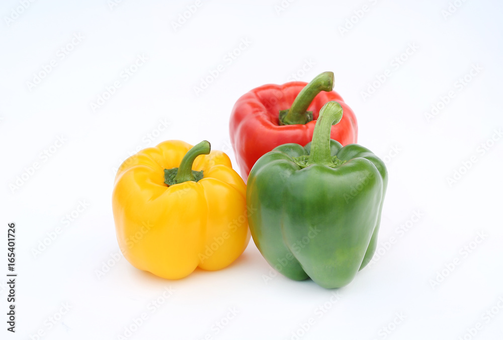 Green, red and yellow bell pepper isolated on white background. Green, red and yellow bell pepper isolated on white background.