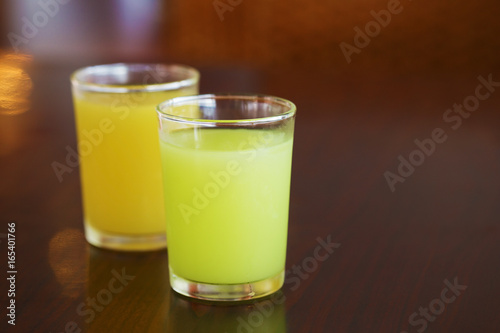 guava juice and orange juice on table