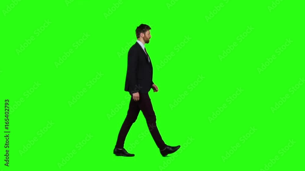 Man walks calmly down the street, he is happy. Green screen. Slow motion Man walks calmly down the street, he is happy. Green screen. Slow motion