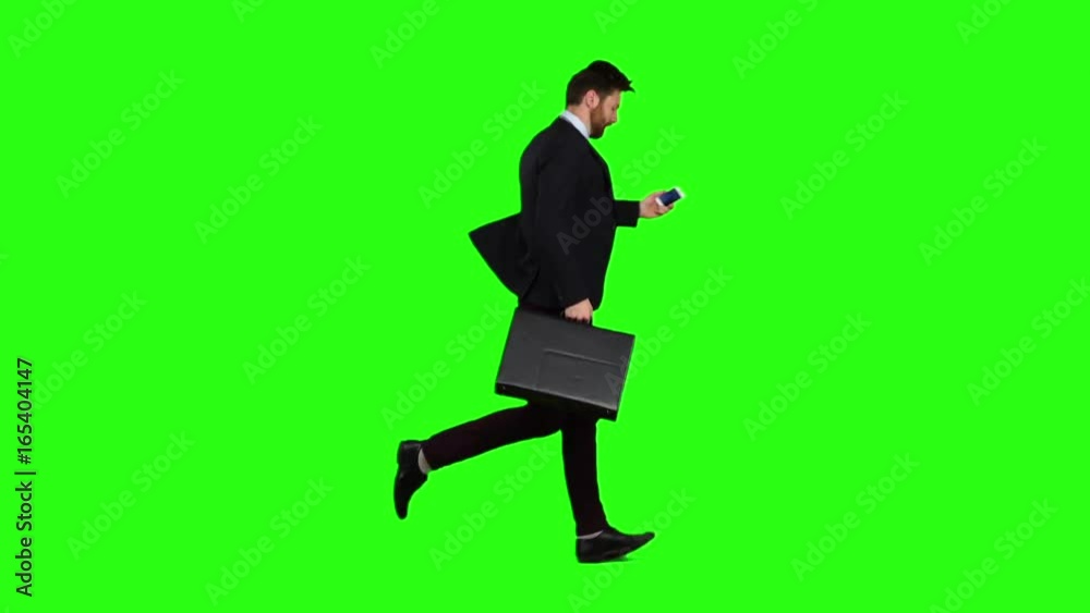 Man is running to work, understands that he is late and begins to run. Green screen. Slow motion Man is running to work, understands that he is late and begins to run. Green screen. Slow motion
