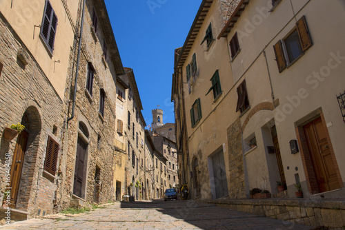 Beautiful narrow street of historic tuscan city Volterra  Italy