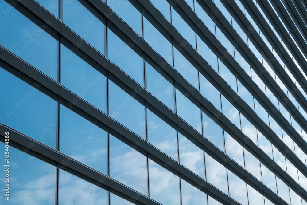 Sky reflected in a modern building glass facade Sky reflected in a modern building glass facade