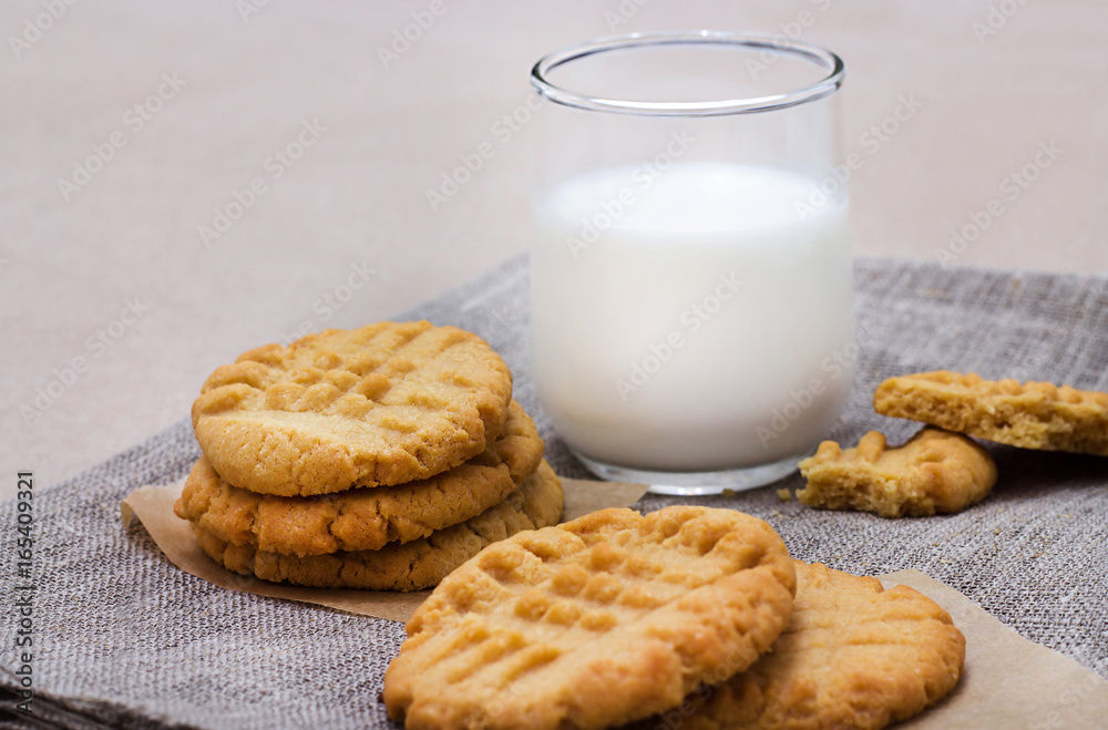 Healthy peanut butter cookies and glass of milk. Linen napkin background Healthy peanut butter cookies and glass of milk. Linen napkin background