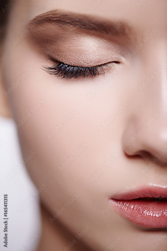 Half face female beauty portrait with day makeup and eyes closed Half face female beauty portrait with day makeup and eyes closed