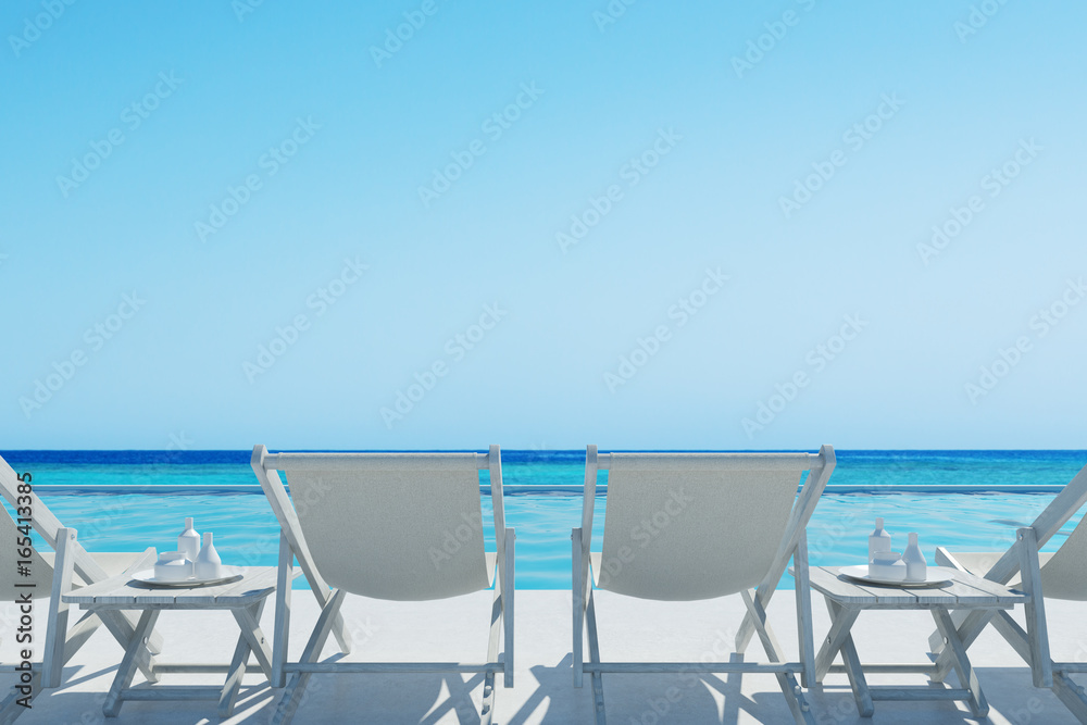 White deckchairs and a table, rair view