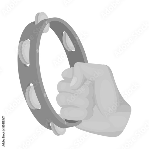 A tambourine that produces a melodic sound. Tambourine in his hand single icon in monochrome style vector symbol stock illustration web.