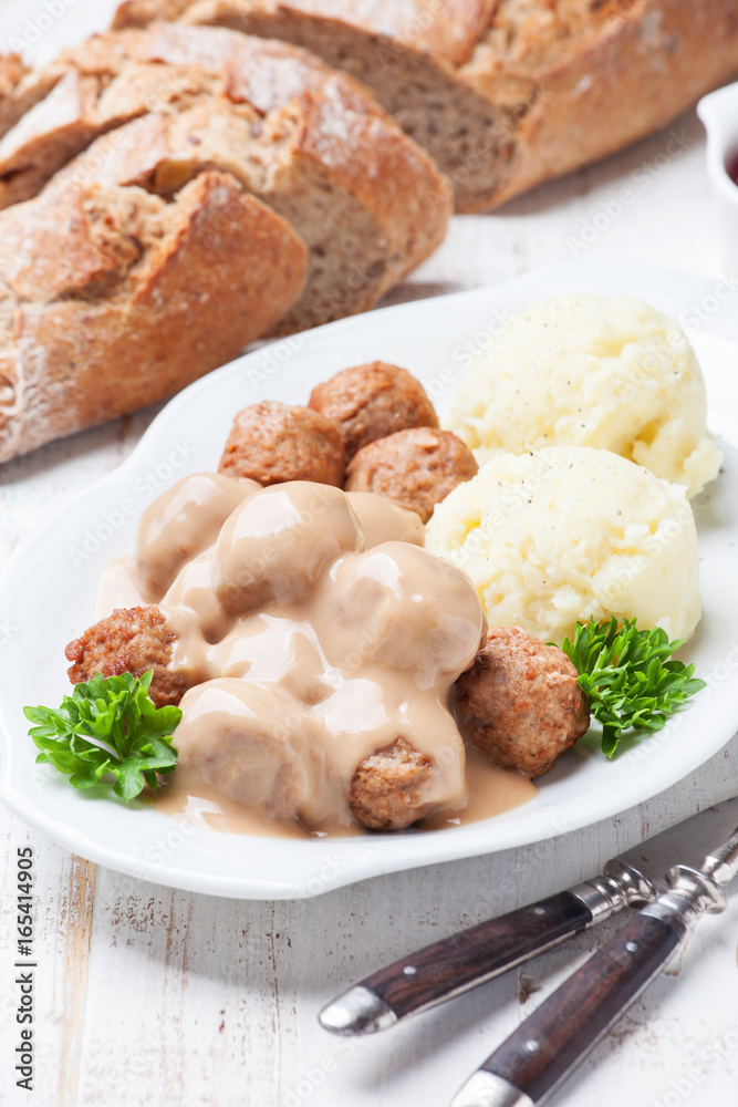 Traditional meatballs with sauce and mashed potatoes