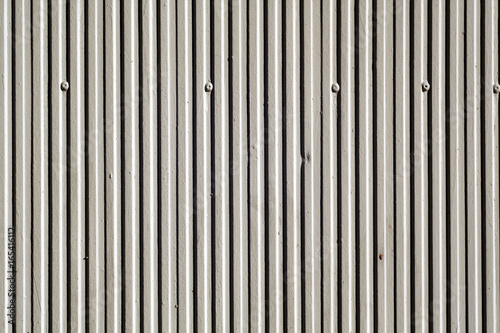 Gray color plaster wall texture with vertical pattern.