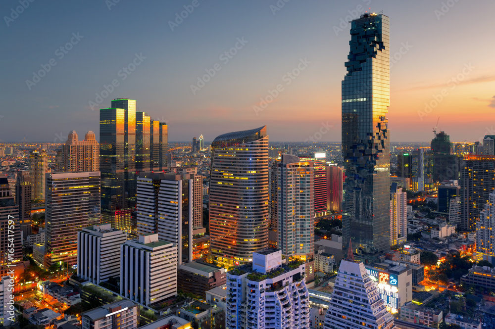 Aerial view of Bangkok modern office buildings, condominium, living place in Bangkok city downtown with sunset scenery, Bangkok is the most populated city in Southeast Asia.Bangkok , Thailand - obrazy, fototapety, plakaty 