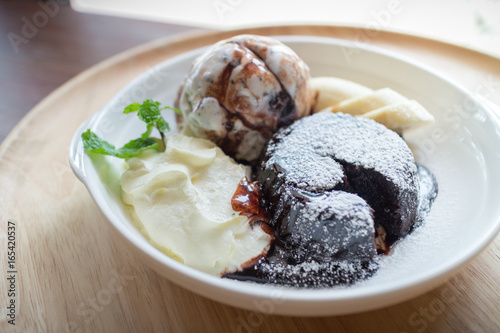 hot chocolate lava cake with vanilla ice cream ball  banana and whipped cream