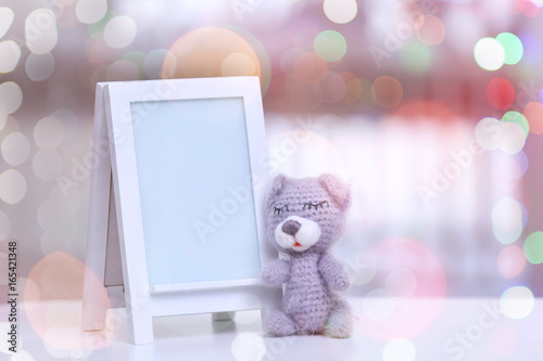 Empty photo frame with toy ...