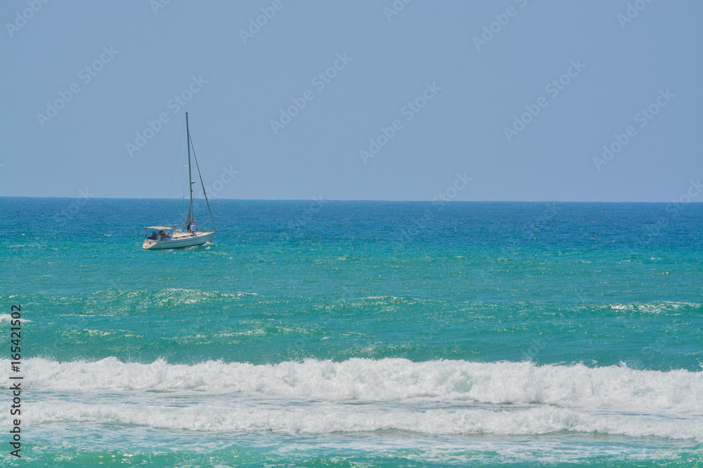 A sailboat on the Mediterranean Sea in Ashkelon, Israel A sailboat on the Mediterranean Sea in Ashkelon, Israel