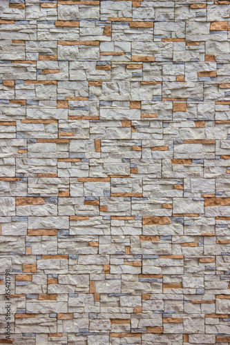 Orange and gray stone in masonry