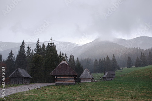 Wooden hut in the fog