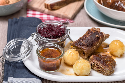 Rinderroulade nach Hausmannsart mit Rotkohl und Kartoffelklößen. photo