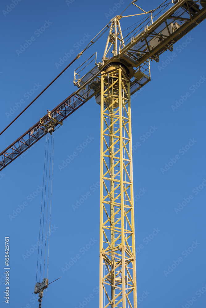 Construction crane on a clear blue sky background
