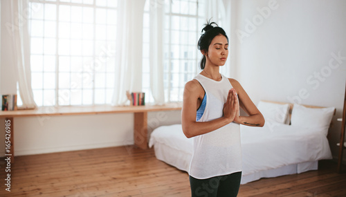 Healthy young woman practising yoga Free Download Healthy young woman practising yoga - GFXLoad
