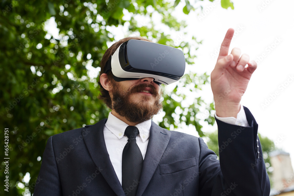 Business professional with vr headset pressing virtual button Business professional with vr headset pressing virtual button