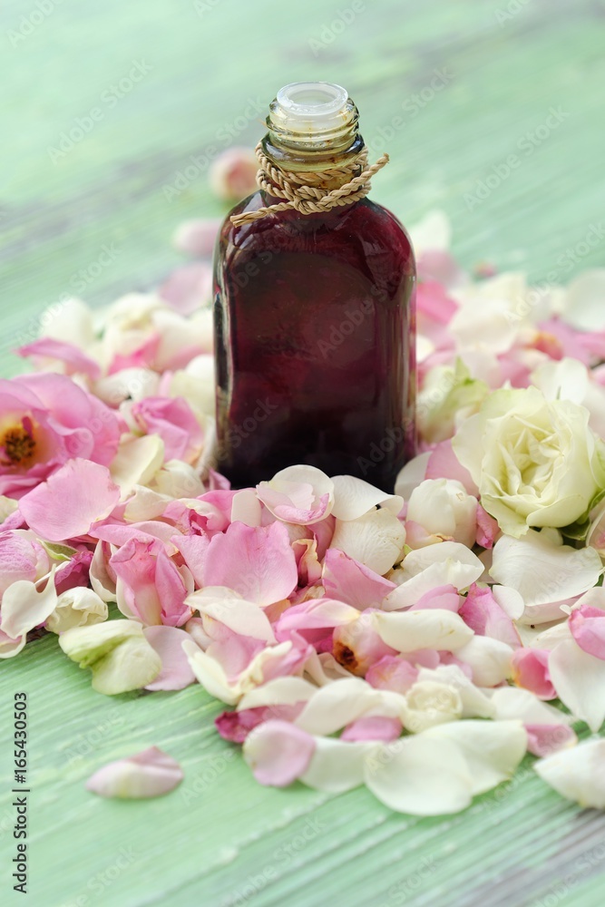 Rose essential oil and flowers petals for Spa treatments Rose essential oil and flowers petals for Spa treatments