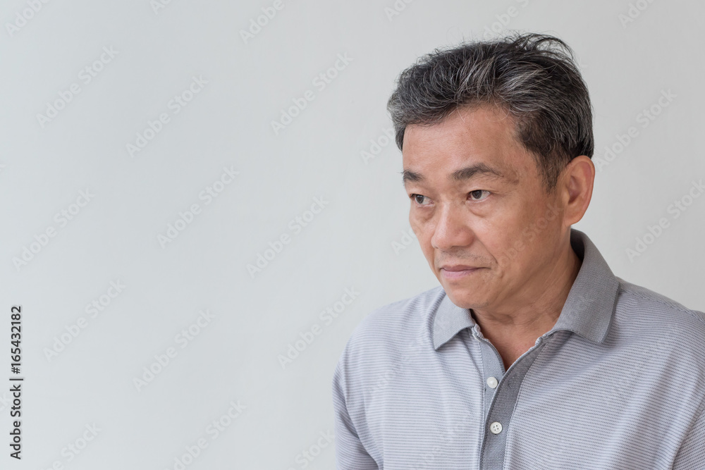 angry, upset, unhappy, frustrated, unfriendly middle age old asian man looking at you angry, upset, unhappy, frustrated, unfriendly middle age old asian man looking at you