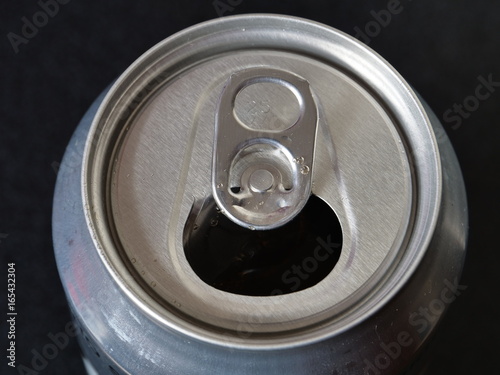 Close up on non descript can of soda or alcohol, opened ready to drink photo