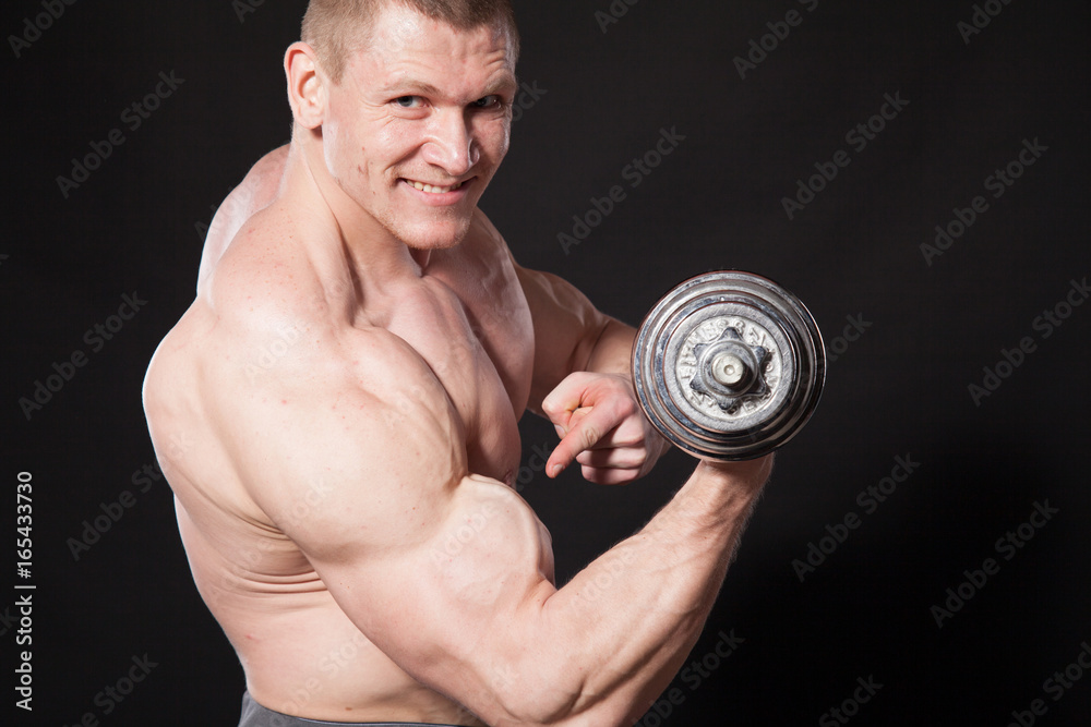 Sport the athlete bodybuilder build muscles dumbbells Sport the athlete bodybuilder build muscles dumbbells