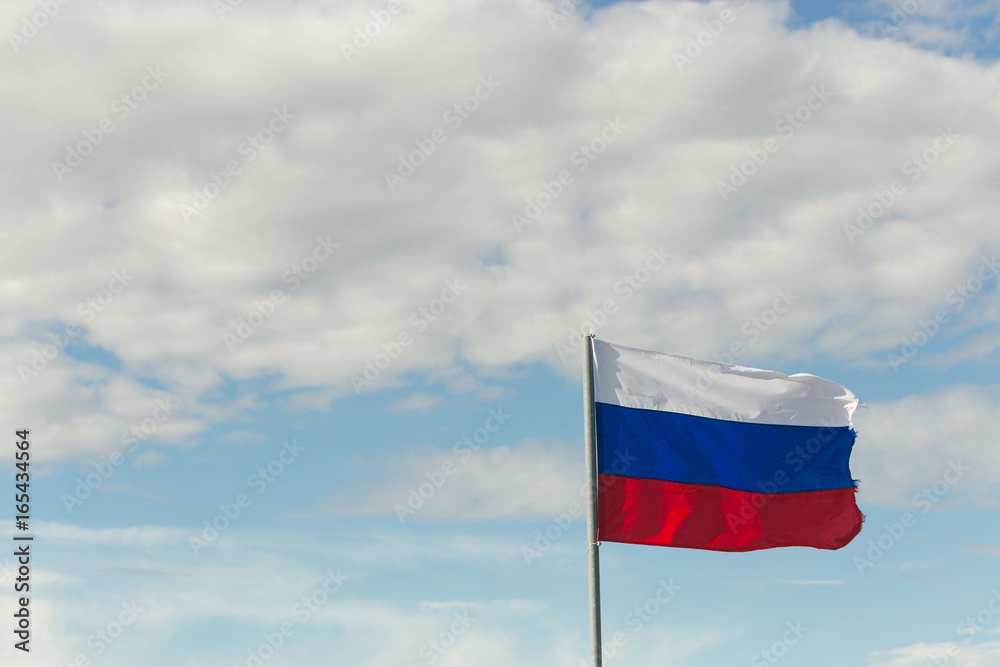 St. Petersburg, Russia - June 28, 2017: Flag of Russia in the wind in St. Petersburg. St. Petersburg, Russia - June 28, 2017: Flag of Russia in the wind in St. Petersburg.