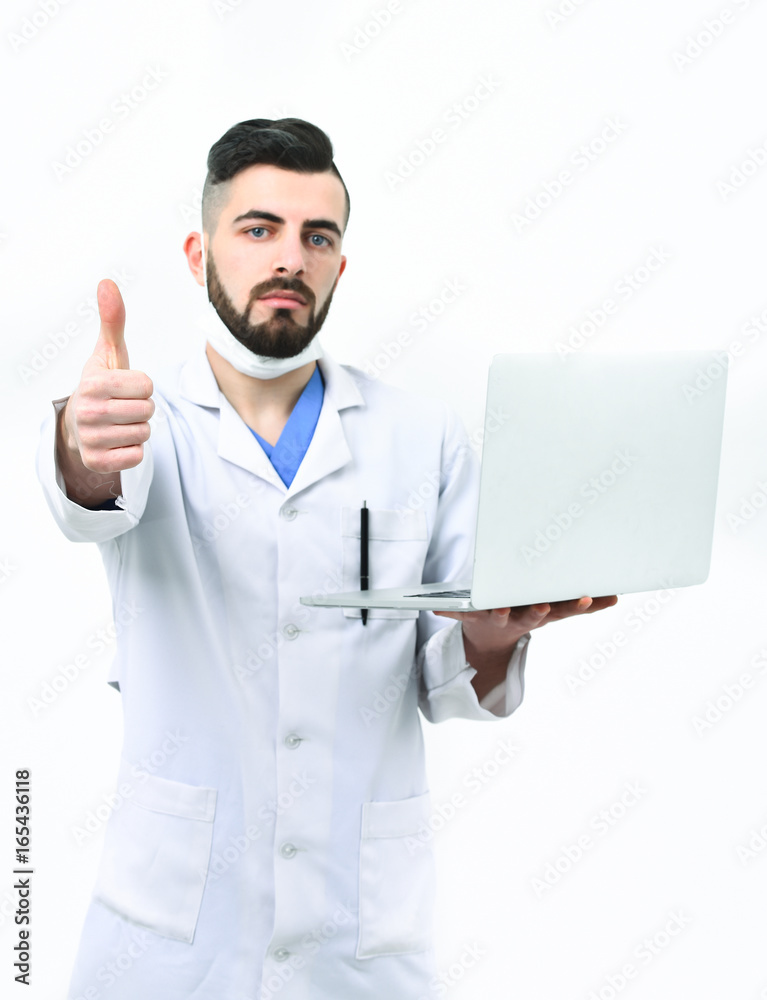 Doctor with beard holds white laptop and shows thumbs up Doctor with beard holds white laptop and shows thumbs up