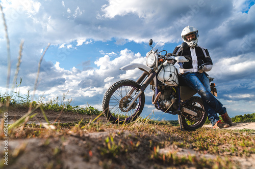 Fototapeta Naklejka Na Ścianę i Meble -  travel motorcycle off road Motorcyclist gear, A motorcycle driver looks, concept, active lifestyle, enduro
