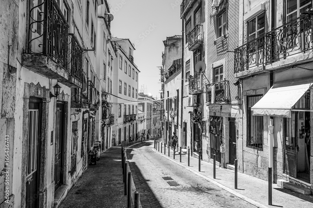Fototapeta Narrow streets in historic district of Lisbon - LISBON / PORTUGAL - JUNE 17, 2017
