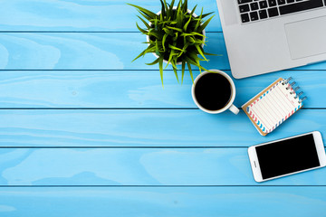 Office desktop with modern laptop. Business background
