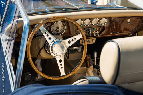 interior of a blue morgan +8 cabriolet car - oldtimer