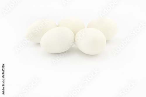 Five white eggs, isolated on white background