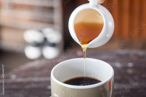 Honey with fresh coffee