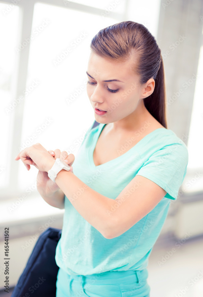 surprised student girl looking at wristwatch surprised student girl looking at wristwatch