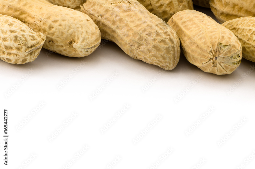 Macro closeup of Peanuts, isolated on white background