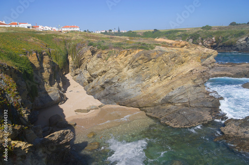 Beach, cliffs and houses in Porto Covo