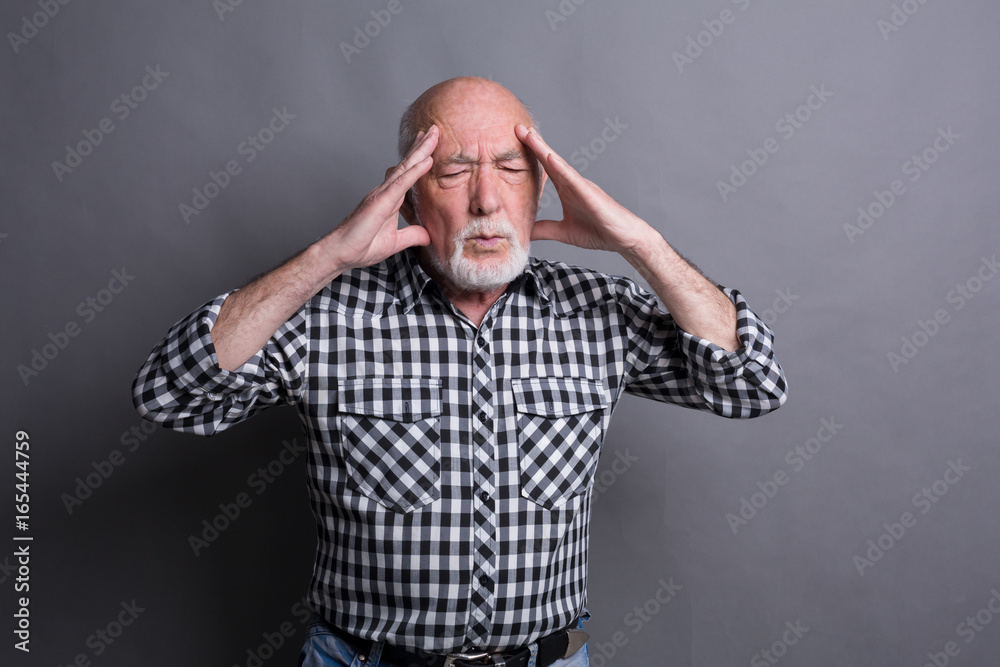 Concentrated senior man thinking about something Concentrated senior man thinking about something