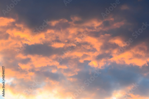 Photo of big fluffy orange clouds after sunset © Pavlo