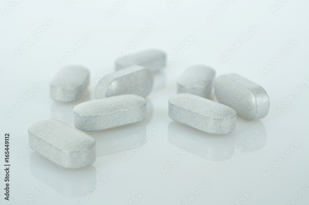 Pharmacy theme, white medicine tablets antibiotic pills. Pharmacy theme, white medicine tablets antibiotic pills.