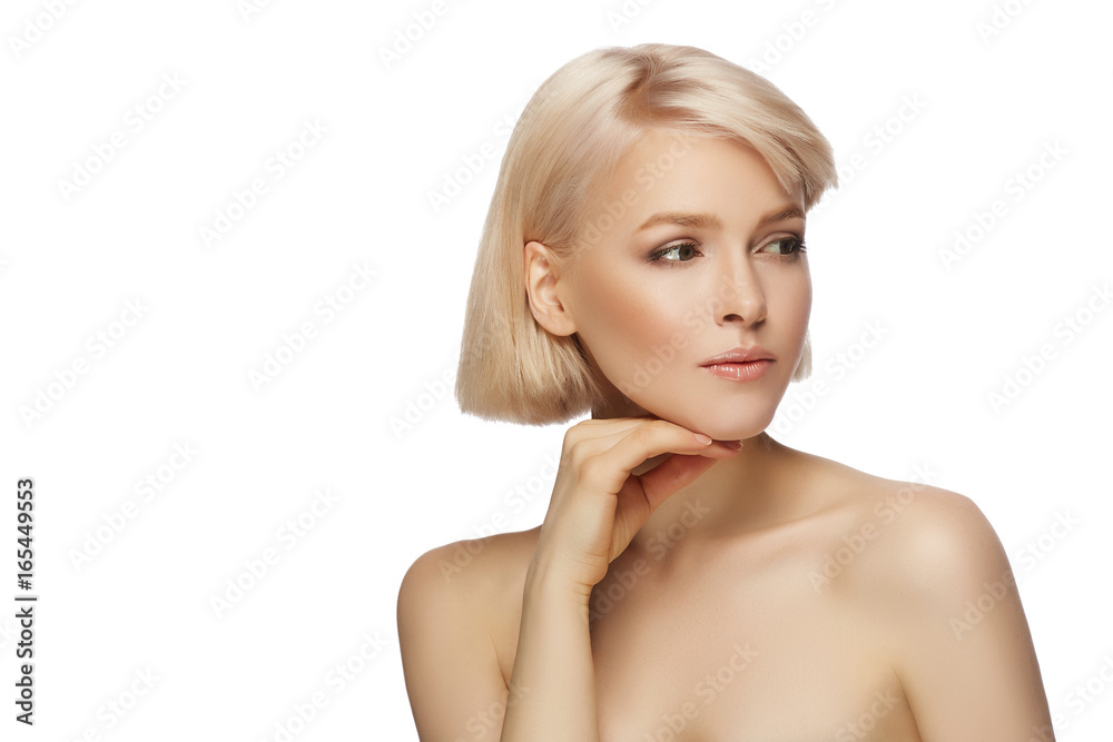 Beautiful blond hair woman with perfect skin touching her face, isolated on white background Beautiful blond hair woman with perfect skin touching her face, isolated on white background
