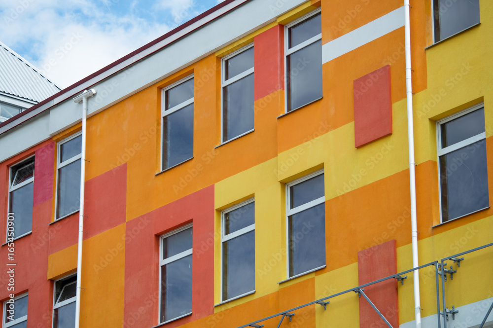 A modern building with a colorful facade. New building.