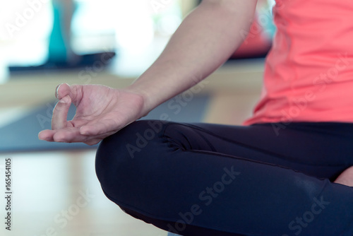 Close up hand asia people practicing and exercising vital meditate yoga in class. Healthy Concept