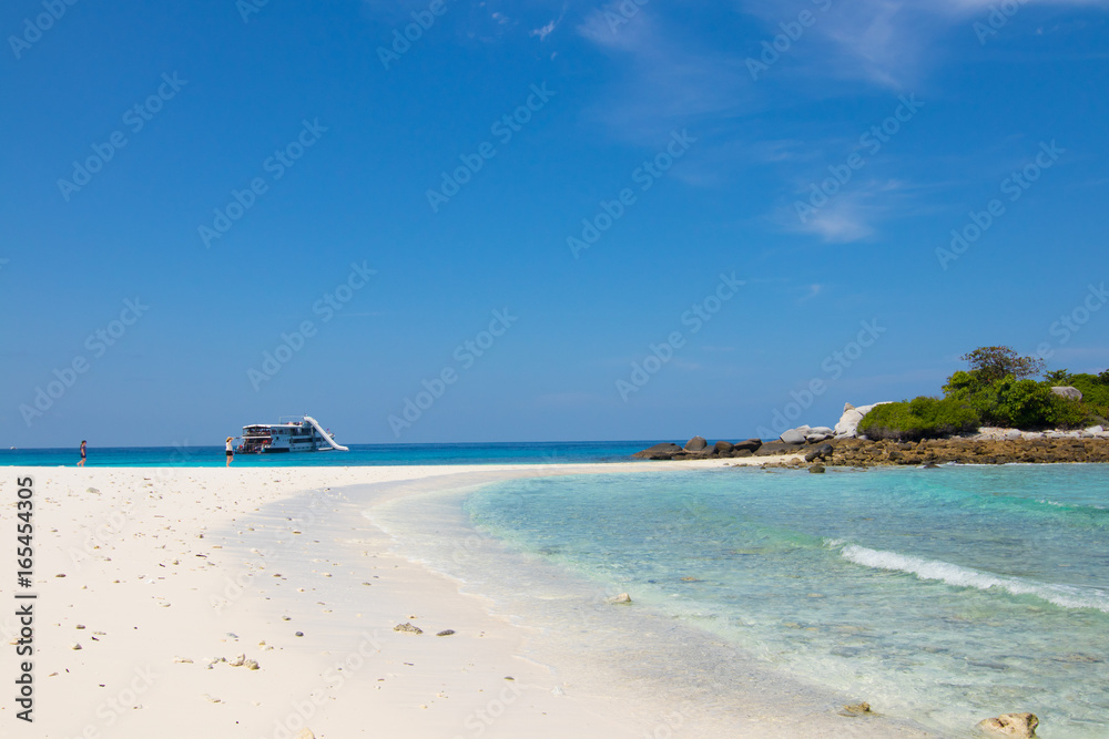 relaxing on the white sand beach at Racha island in Phuket Thailand