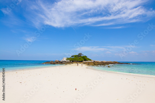 relaxing on the white sand beach at Racha island in Phuket Thailand