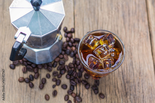  Cold coffee is the old wooden background