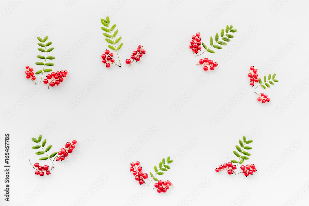 Berry ornament. Red currant and leaves on white background top view copyspace