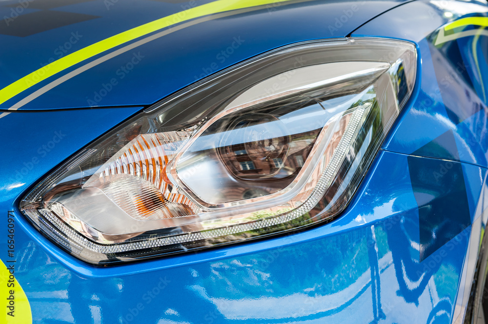 Obraz premium Close up of a blue and yellow sport car